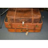 Three vintage suitcases