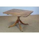 A Georgian mahogany breakfast table, rounded rectangular top, on turned column stem and four