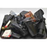 A quantity of optical items and cameras.