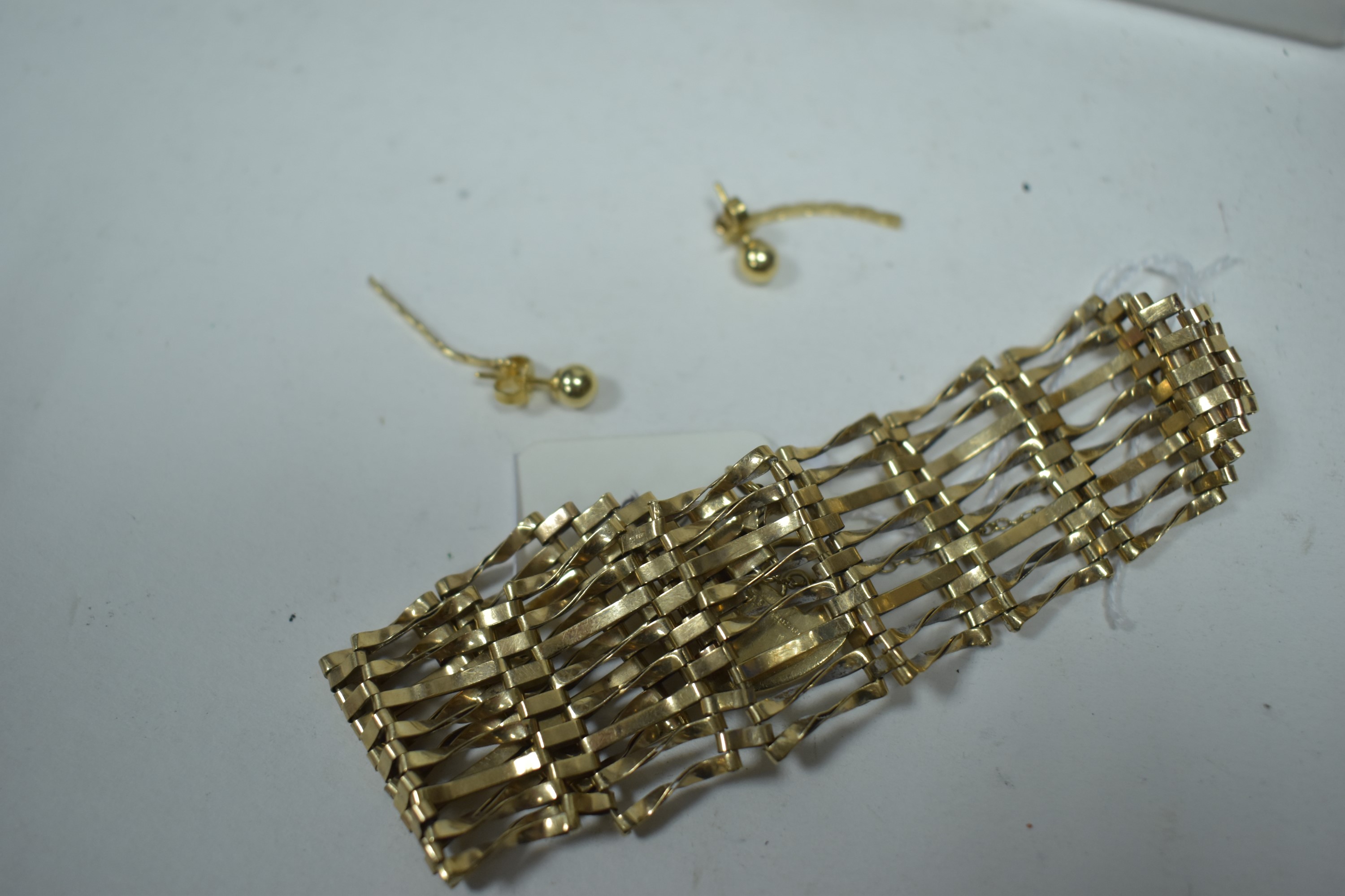 A 9ct gold gate link bracelet, and a pair of earrings