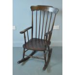 A 20th Century elm rocking chair