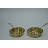 A pair of gilt metal table salts