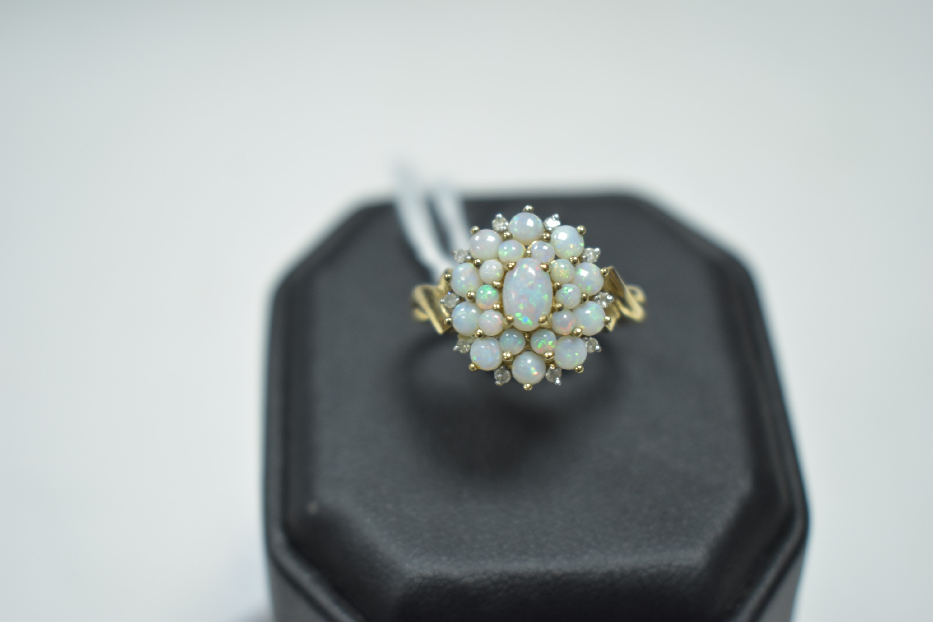 An opal cluster dress ring