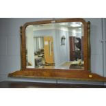 Shaped rectangular bevelled overmantel mirror.