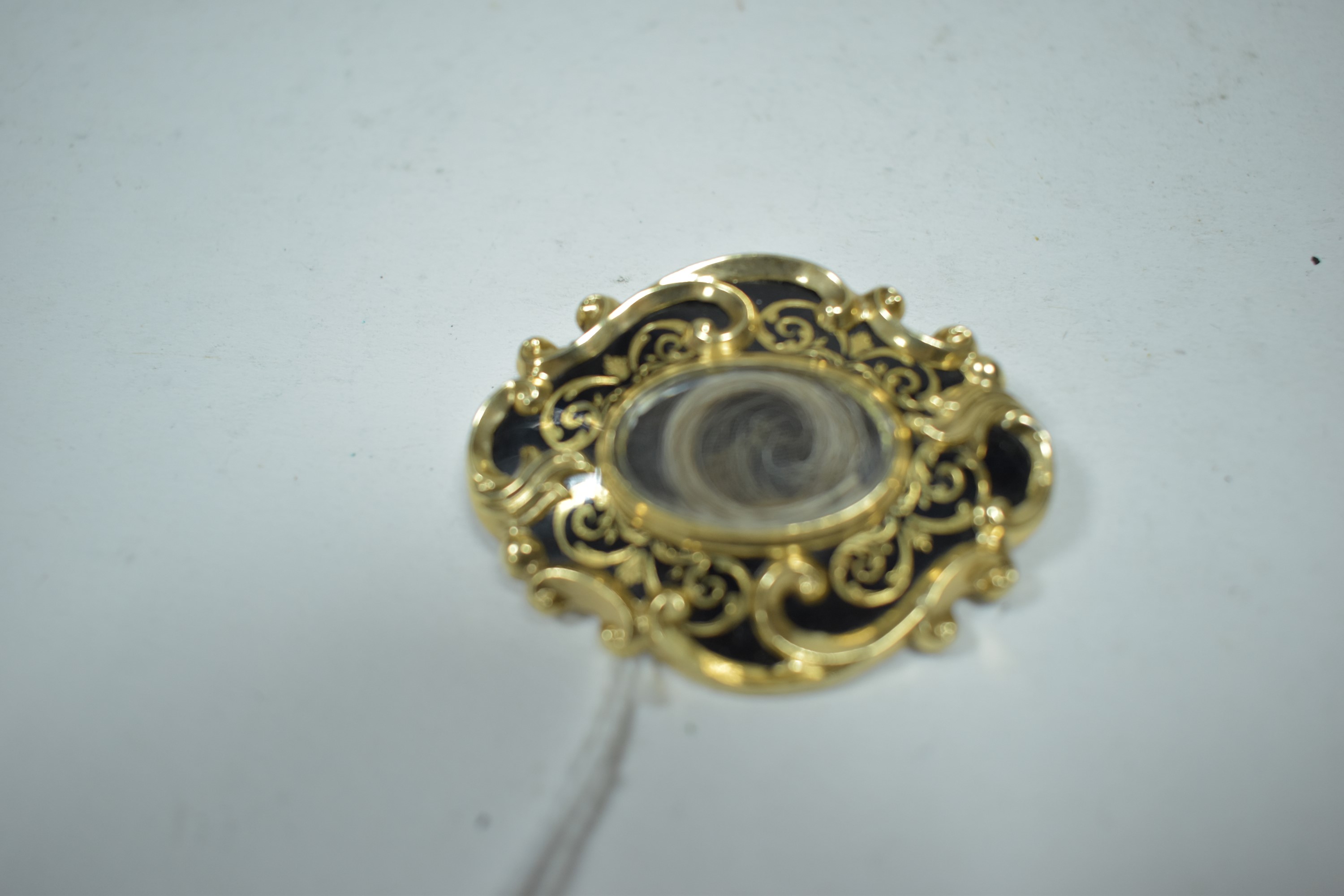 A 19th Century black enamel brooch