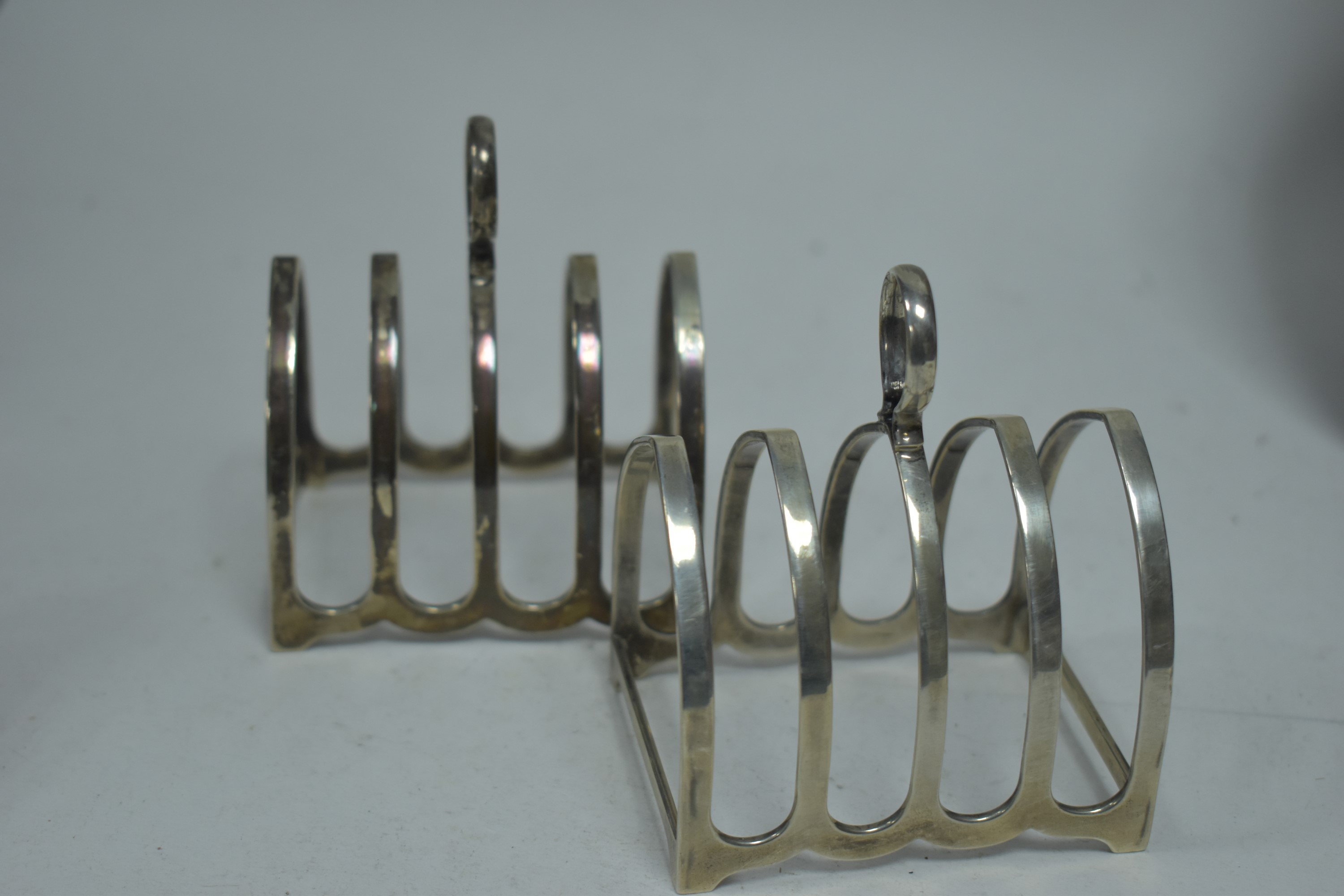 A pair of silver toast racks