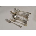 A selection of silver spoons and a fork