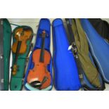 Two student violins and violin cases.