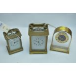 Two French carriage clocks; and a Westclox mantel clock.