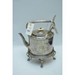 An American silver spoon; and plated metal tea kettle.