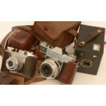 Three vintage cameras.