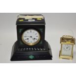 Brass carriage clock; and a French black marble clock.