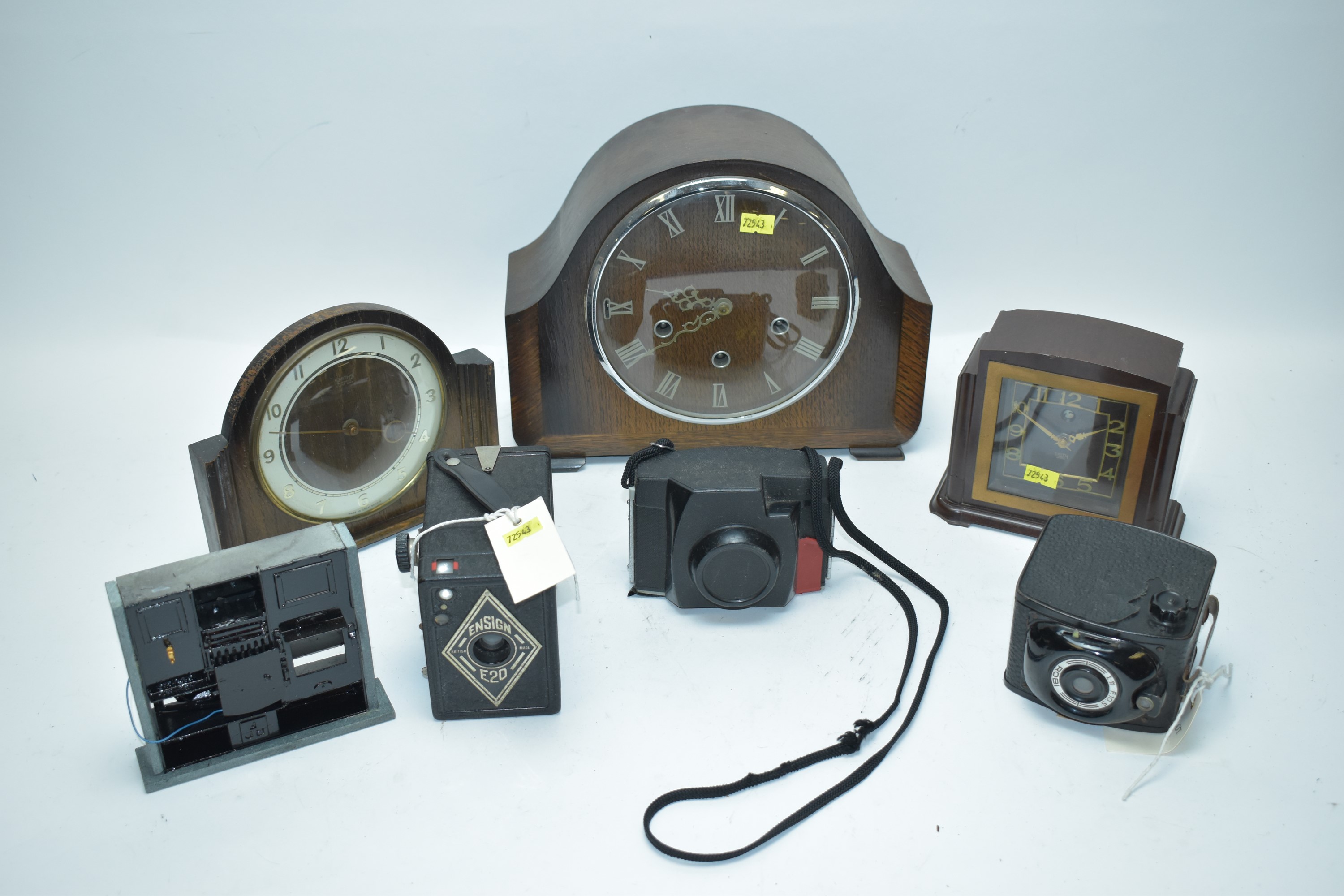 Three clocks; Ensign E20 and Robi cameras; and other items.