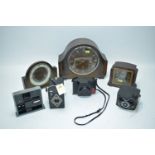 Three clocks; Ensign E20 and Robi cameras; and other items.