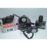 A Pentax DL2 digital camera. / Two Pentax cameras.
