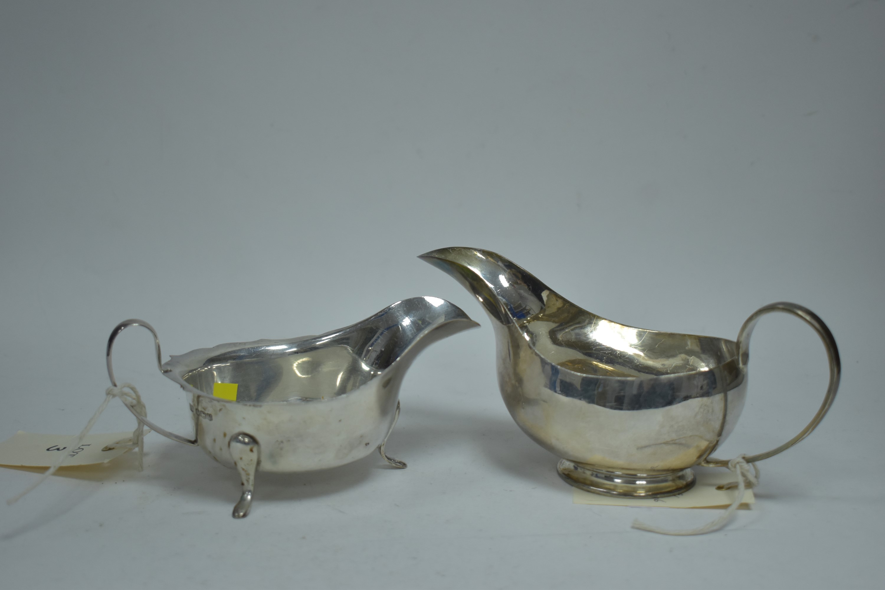 Two silver sauce boats