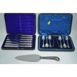 Silver teaspoons, tongs, tea knives and cake slice