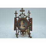 Porcelain miniature bust portrait of a lady on easel stand.