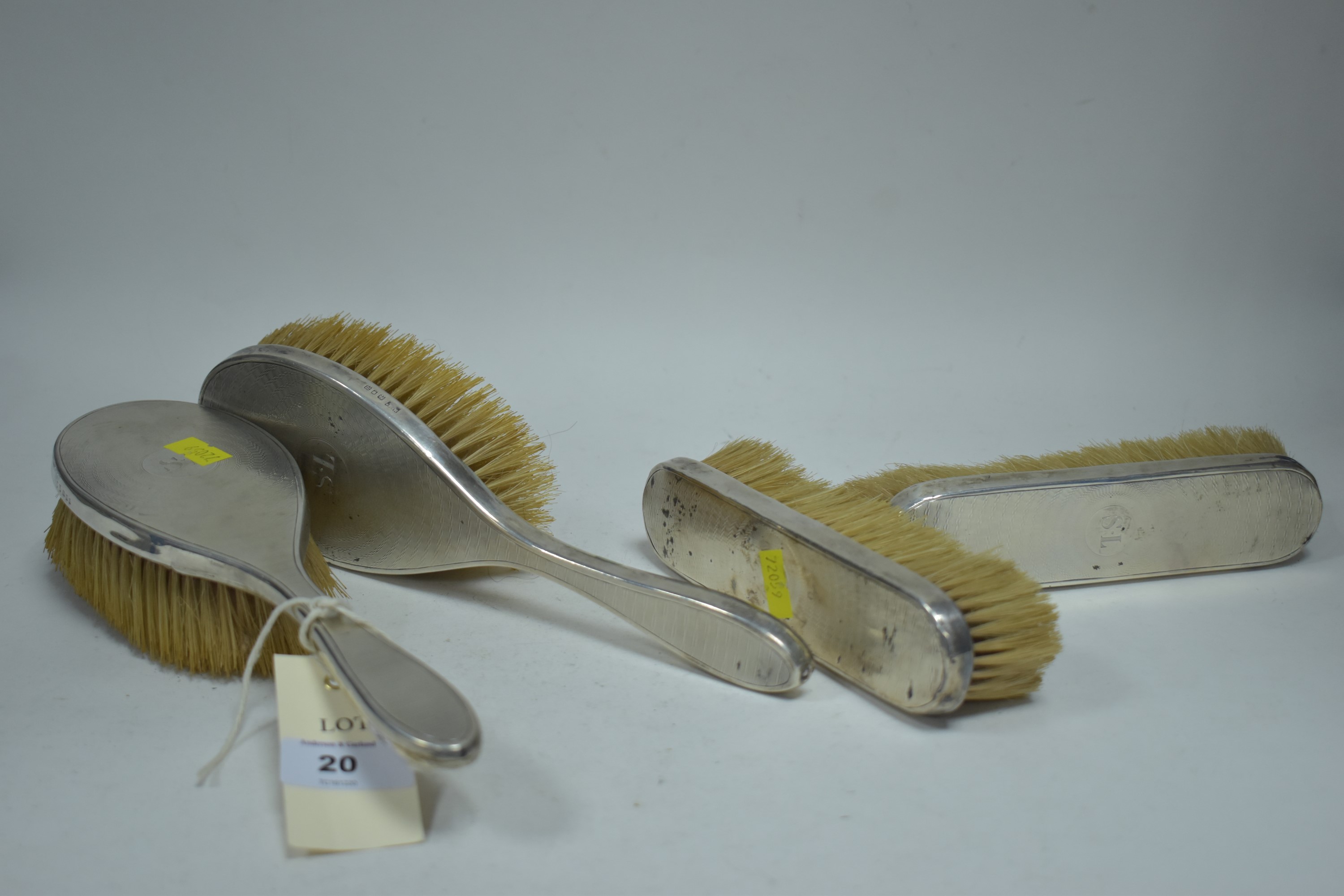 Four silver mounted brushes