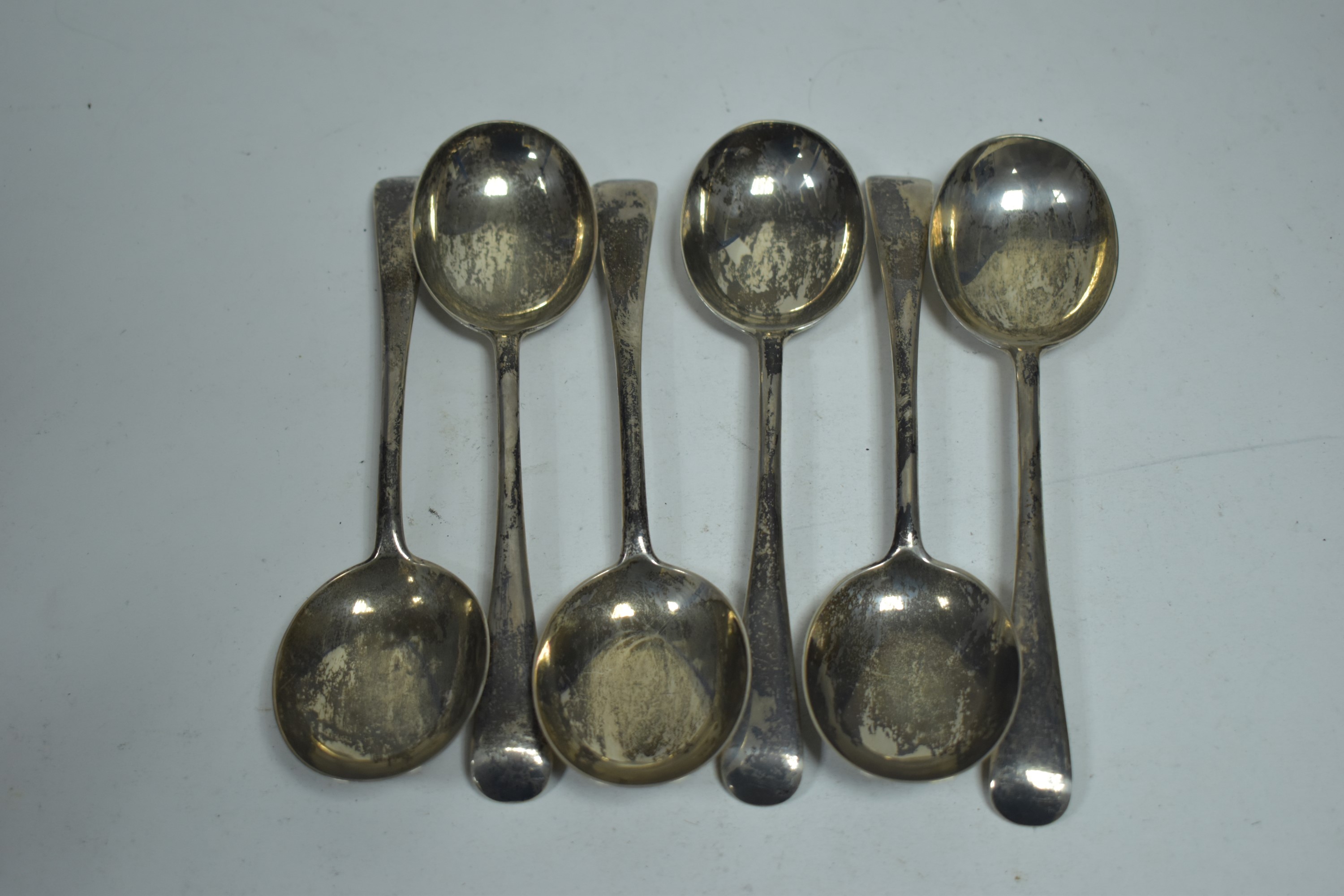 Set of six silver dessert spoons