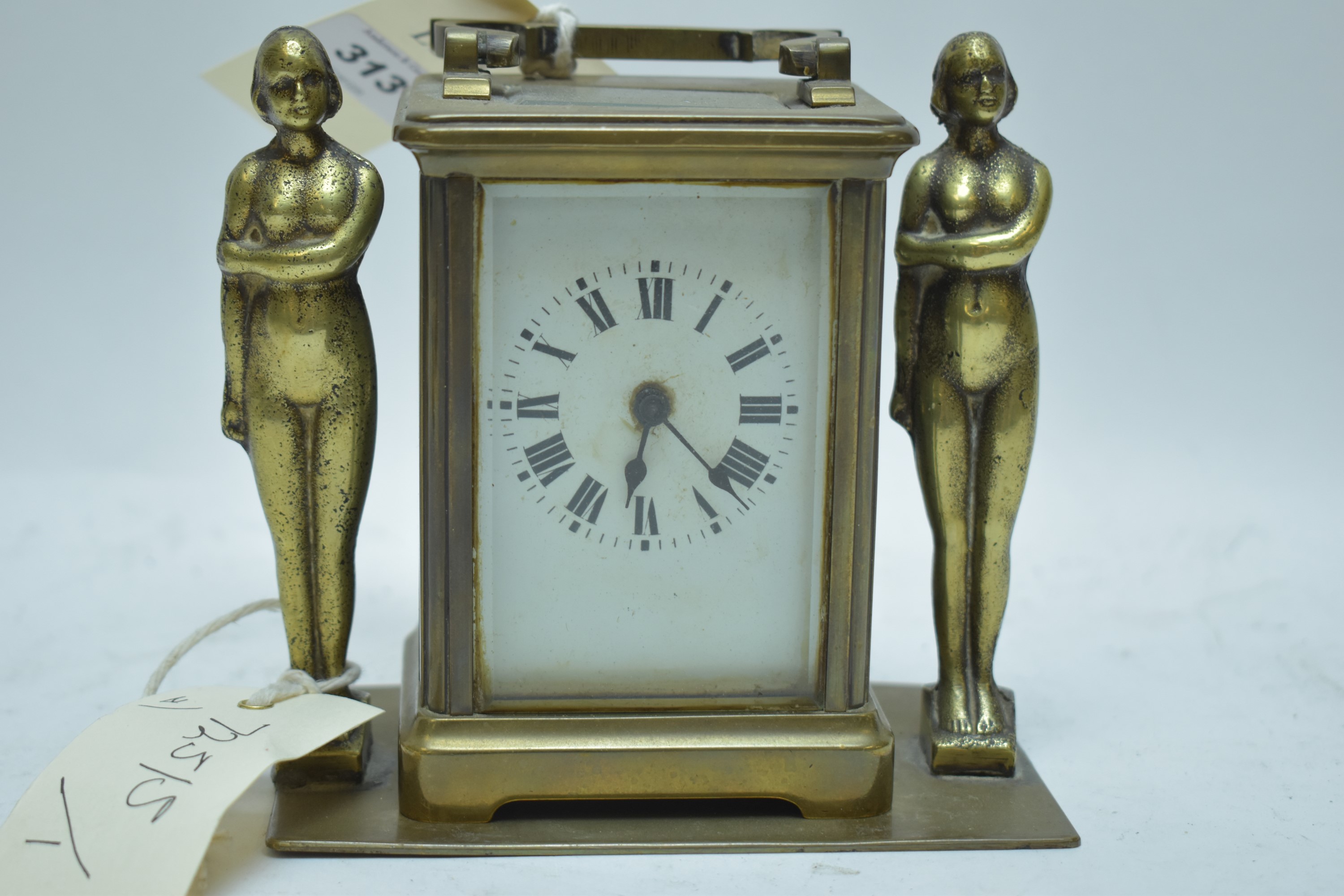 French brass carriage clock; and an Art Deco brass stand.