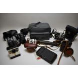 Pentax camera, various other cameras, binoculars, and unspecified sundries.