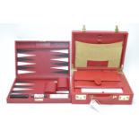 Smythson of Bond Street: a red leather correspondence case, wallet and backgammon game. (3)