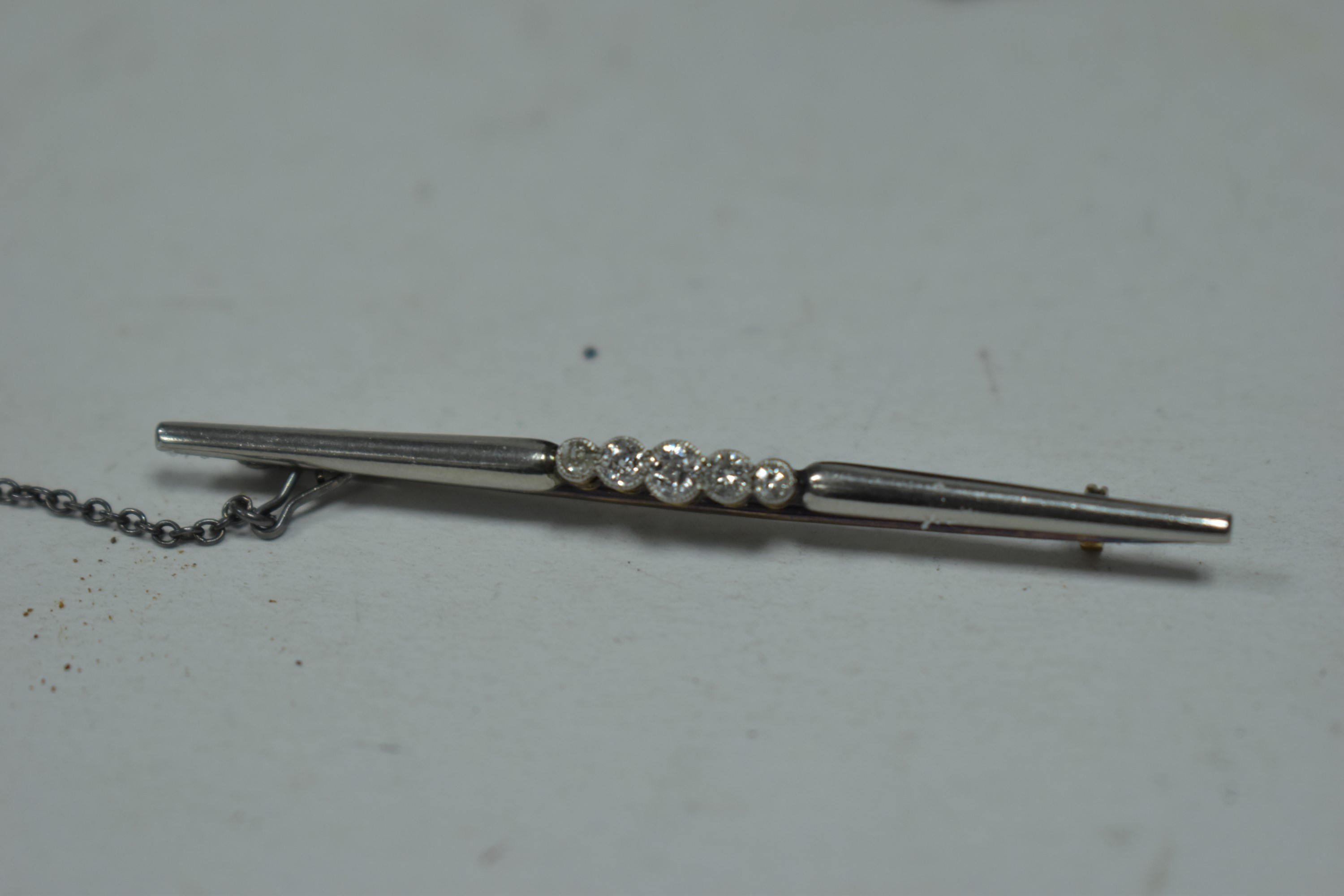 A diamond bar brooch