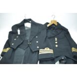 Two Royal Naval Reserve Lt. Commander uniforms.