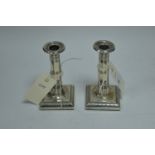 A pair of silver candlesticks