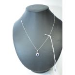 A sapphire and diamond pendant