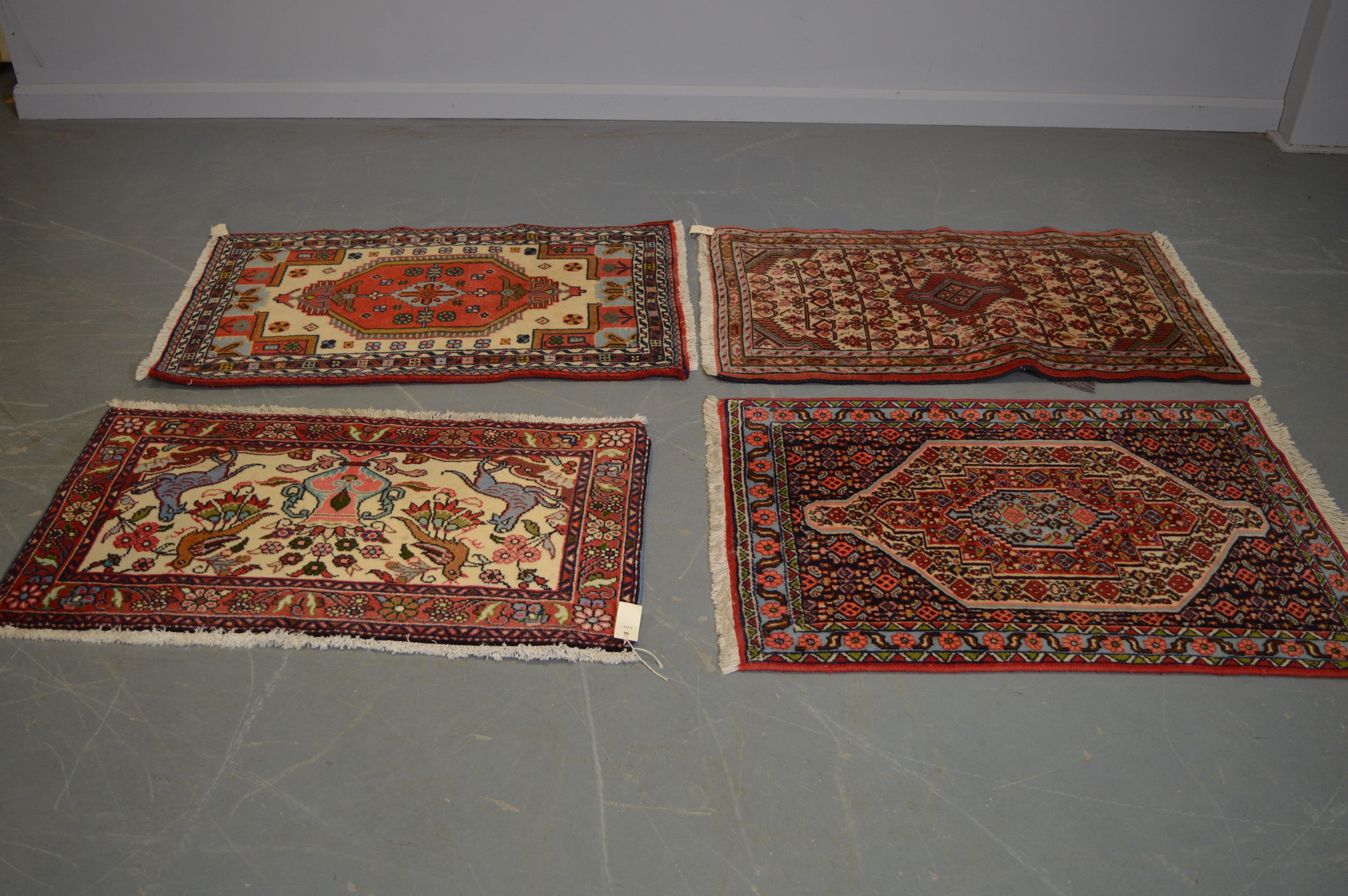 Four modern prayer rugs