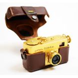 A Riken Golden Steky subminiature camera; and Riken Steinar lens, cased.