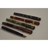 Three Swan fountain pens and two others