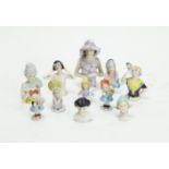 Pincushion dolls in glazed ceramic.