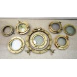 Six brass portholes; two porthole glasses; and a porthole frame.