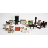A collection of miniature dolls, furniture and other items.