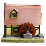 A doll's mill house.