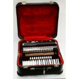 A Hohner Atlantic IVN Musette 120 bass piano accordion.