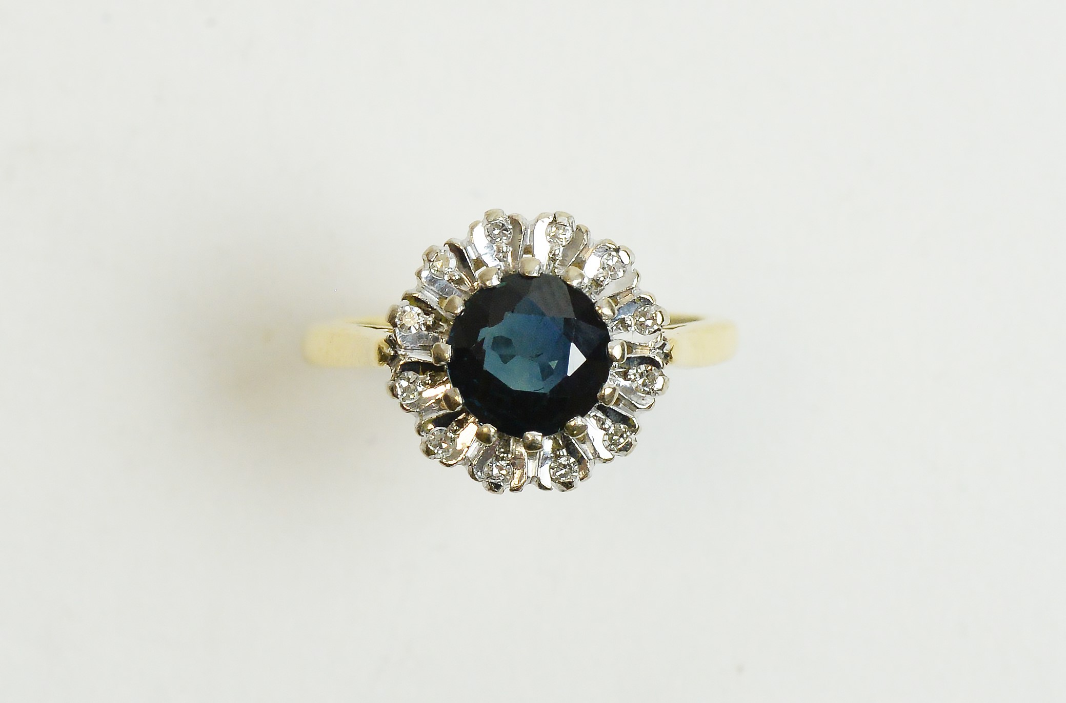 A sapphire and diamond cluster ring