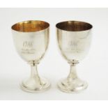 A pair of George III silver goblets