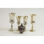 Four Kiddush cups and a covered salt