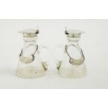 A pair of silver mounted glass whisky tots