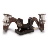 A pair of Victorian ramshorn table snuff mulls, with plated mounts and lion mask feet, 23cms high,