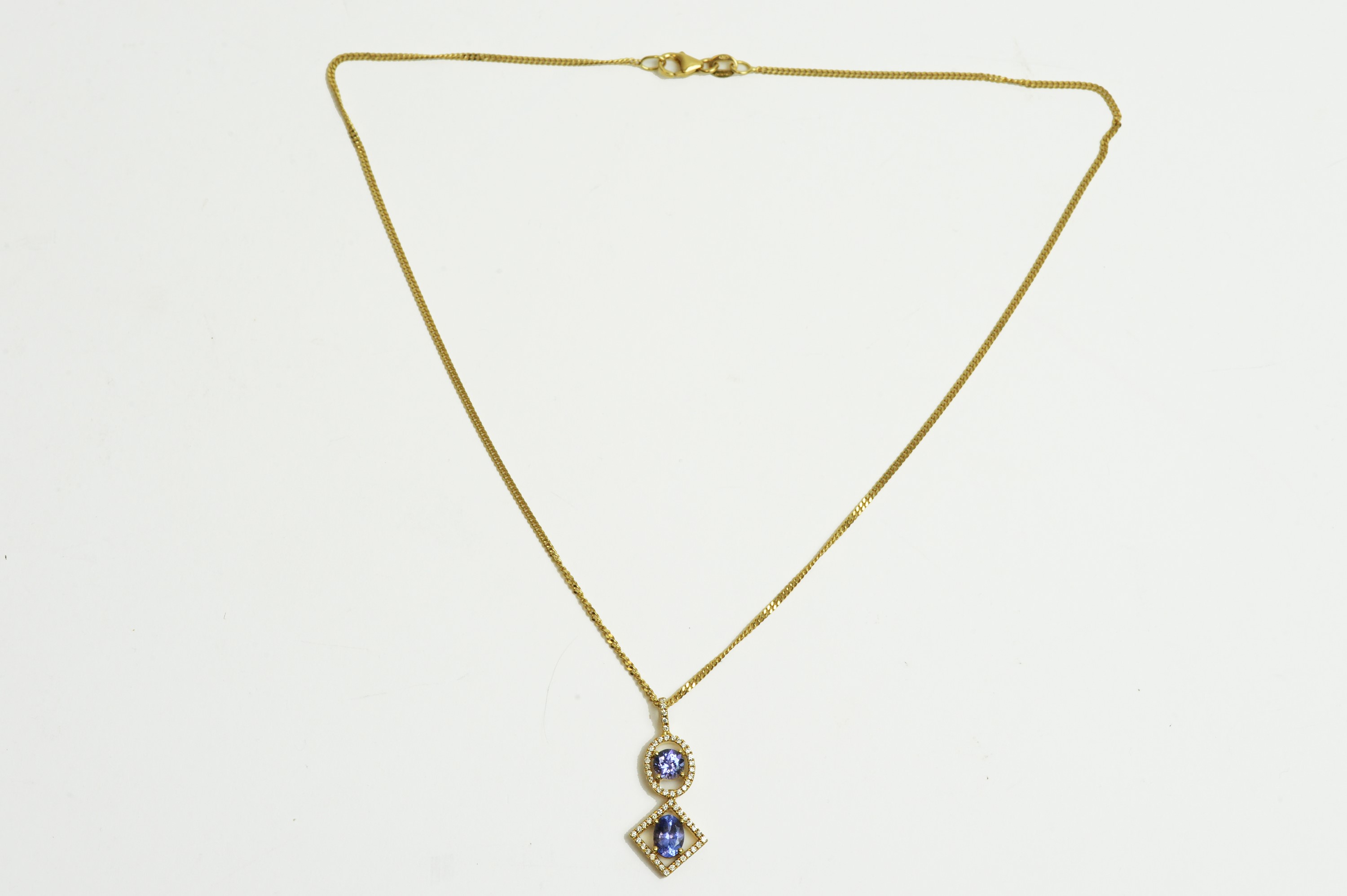 A tanzanite and diamond drop pendant - Image 4 of 4