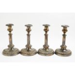 Four Sheffield plated candlesticks