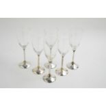 A set of six champagne glasses with silver stems