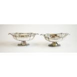 A pair of silver dishes