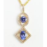 A tanzanite and diamond drop pendant