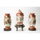 Garniture of three Kutani vases and stands
